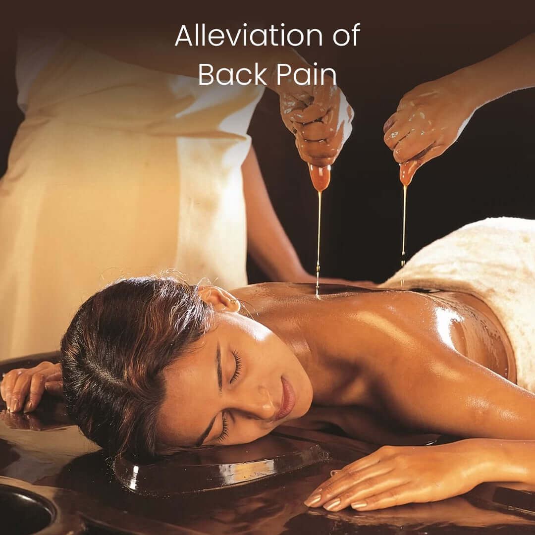 Traditional Ayurvedic oil pouring therapy in Back Spine Pain Treatment to relieve back pain, calm nerves, and improve spinal mobility.