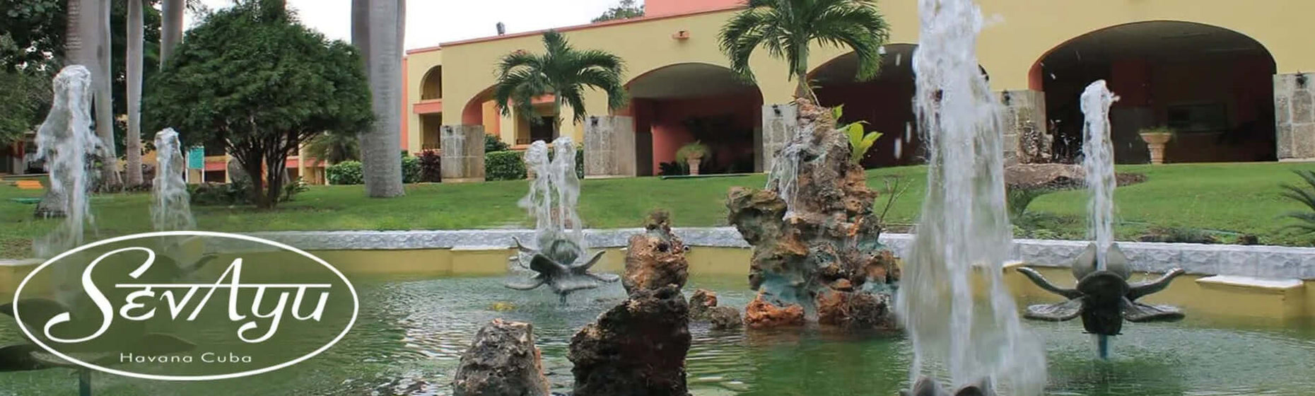Outdoor view of Sevayu Cuba Ayurveda center in Havana, featuring flowing fountains and tranquil surroundings.