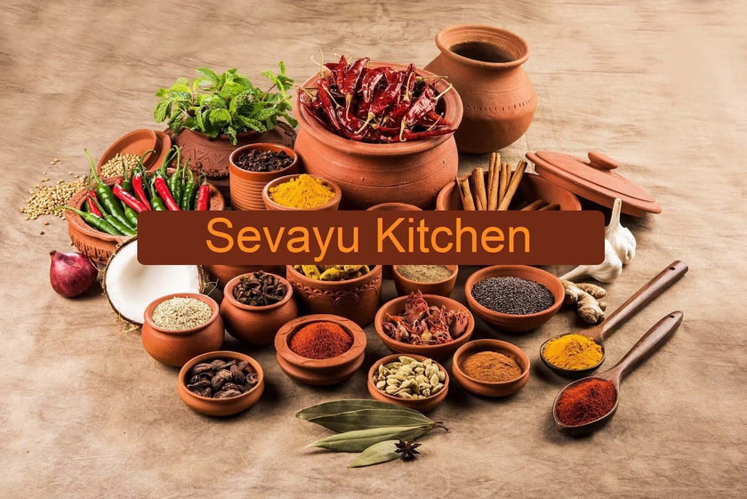 An arrangement of traditional Ayurvedic spices and herbs in clay pots used in the Sevayu Kitchen to provide healing, sattvic meals for retreat guests.